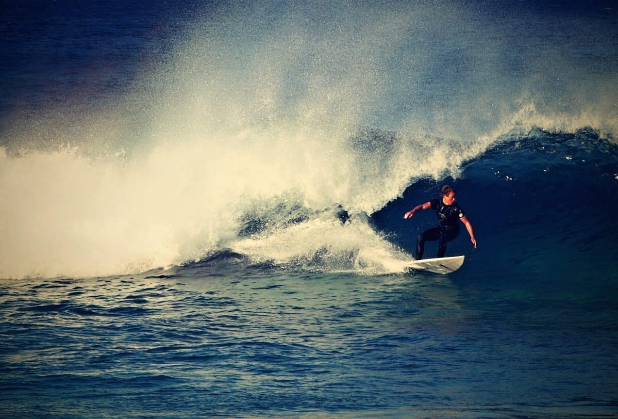 guy surfing the wave in sydney bondi beach